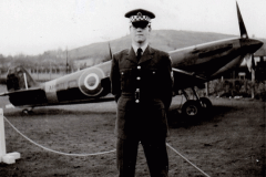 Graham McCullough in front of the Spitfire at RAF Hereford with Credenhill in the background.