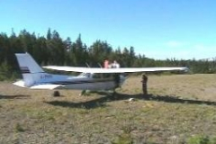 The pilot fuelling up the
plain on the 'runway'.